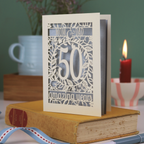 A laser cut Golden anniversary card personalised for Mom and Dad, 50 Amazing years
