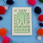 Personalised Happy 50th birthday card with colourful pom-poms on a blue background