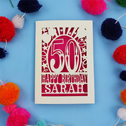 Happy 50th birthday card with colourful pom-poms on a blue background