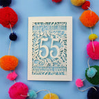 55th wedding anniversary Card with '55 amazing years' design on a blue background with colourful pom-poms.