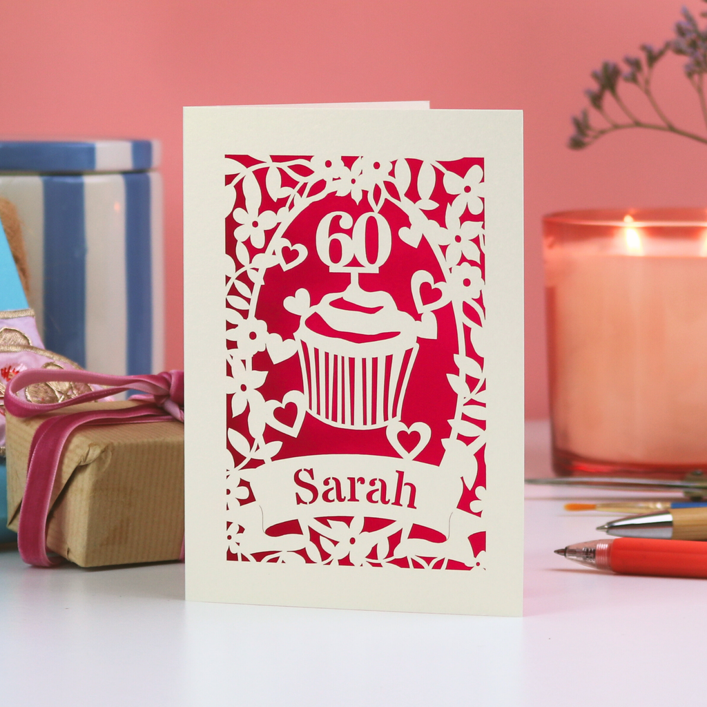 A personalised birthday card with laser cut cupcake design, age and name.
