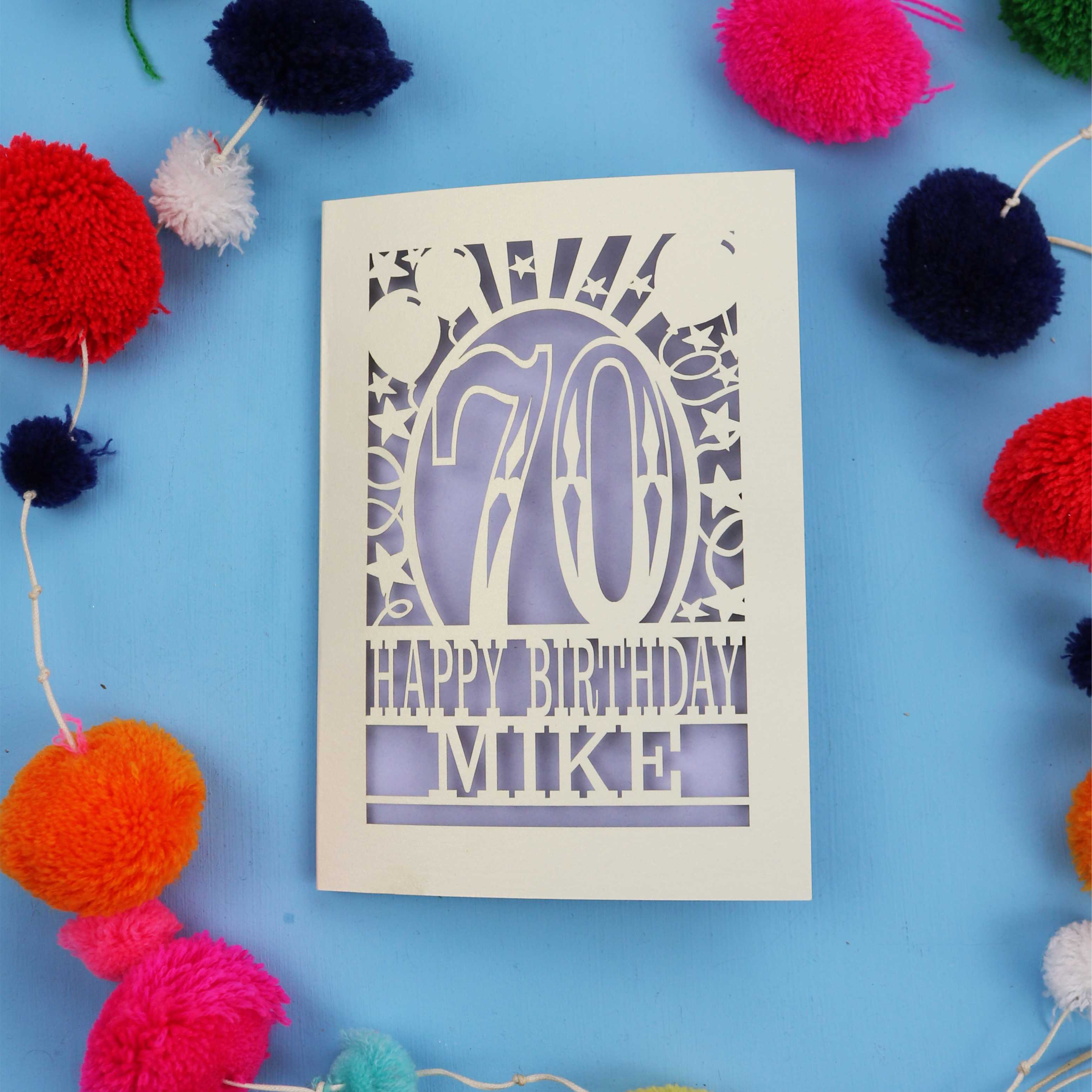 Laser cut personalised 70th birthday card with balloons, stars and the number 70 in a bold circus font.