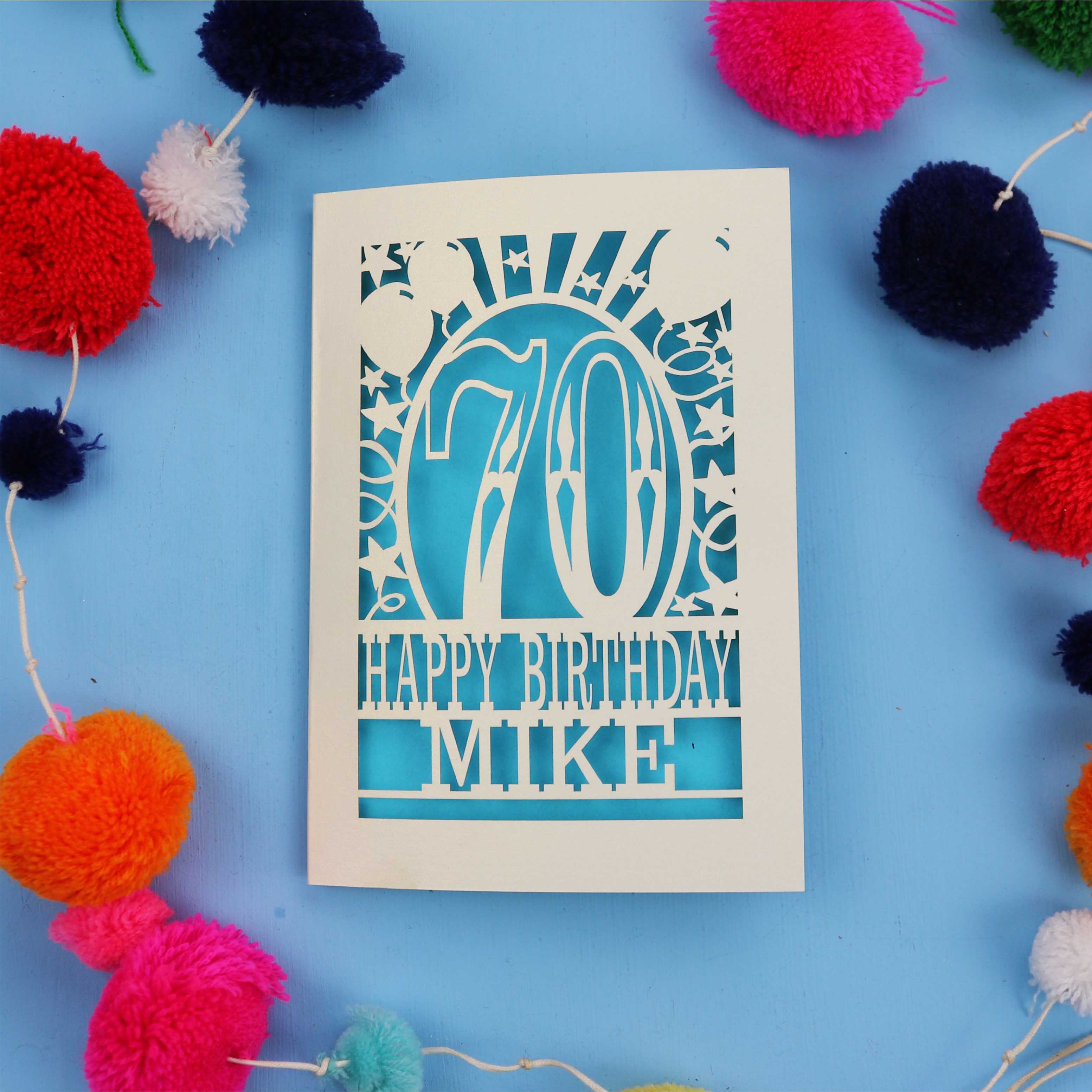 Laser cut personalised 70th birthday card with balloons, stars and the number 70 in a bold circus font.
