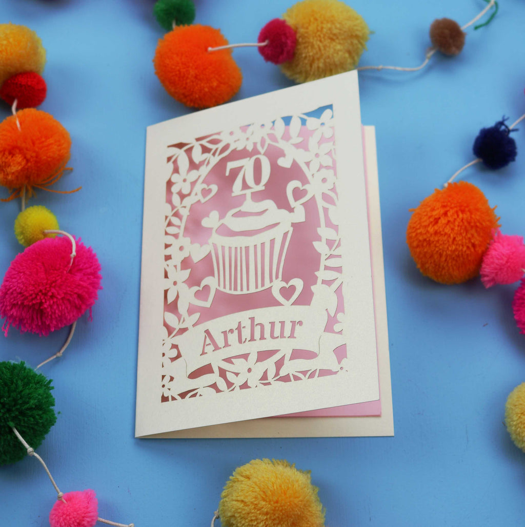 A laser cut 70th birthday card with cupcake design and personalised with a name