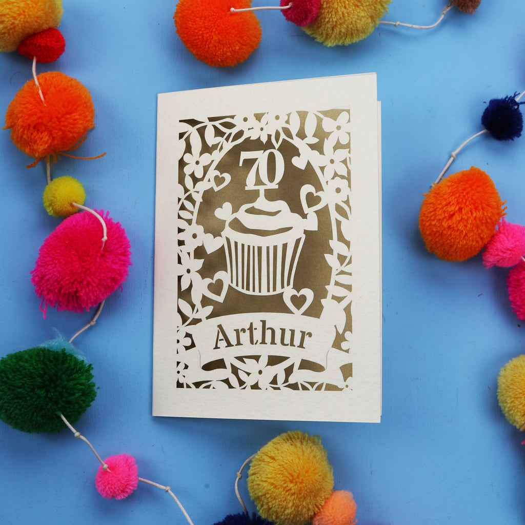 A laser cut 70th birthday card with cupcake design and personalised with a name