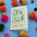 A laser cut 70th birthday card with cupcake design and personalised with a name