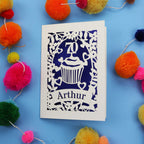A laser cut 70th birthday card with cupcake design and personalised with a name