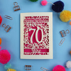A special 70th birthday card with 'Happy Birthday' and personalised with the recipient's name. The number 70 is in the centre, surrounded by leaf and floral cut out designs. 
