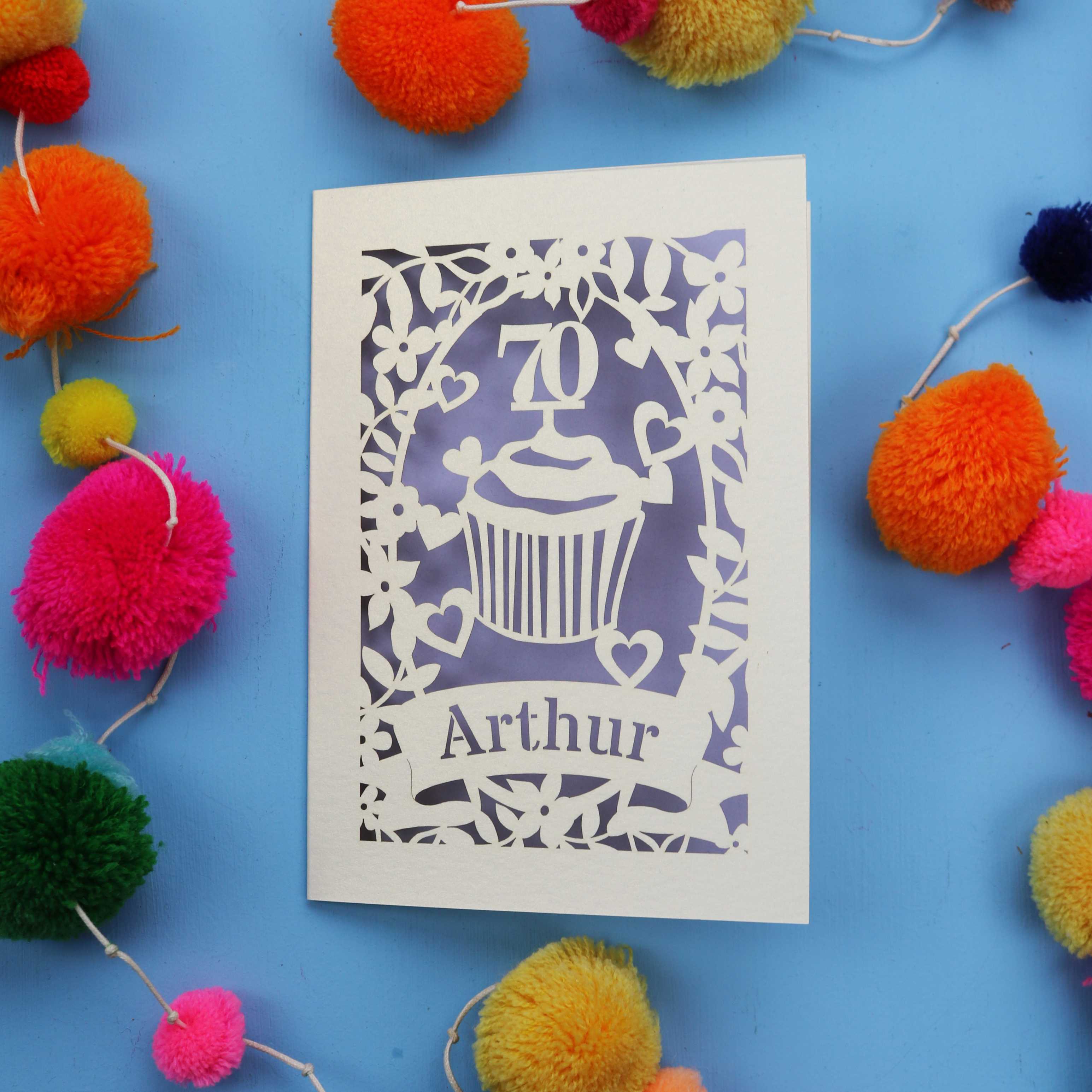 A laser cut 70th birthday card with cupcake design and personalised with a name