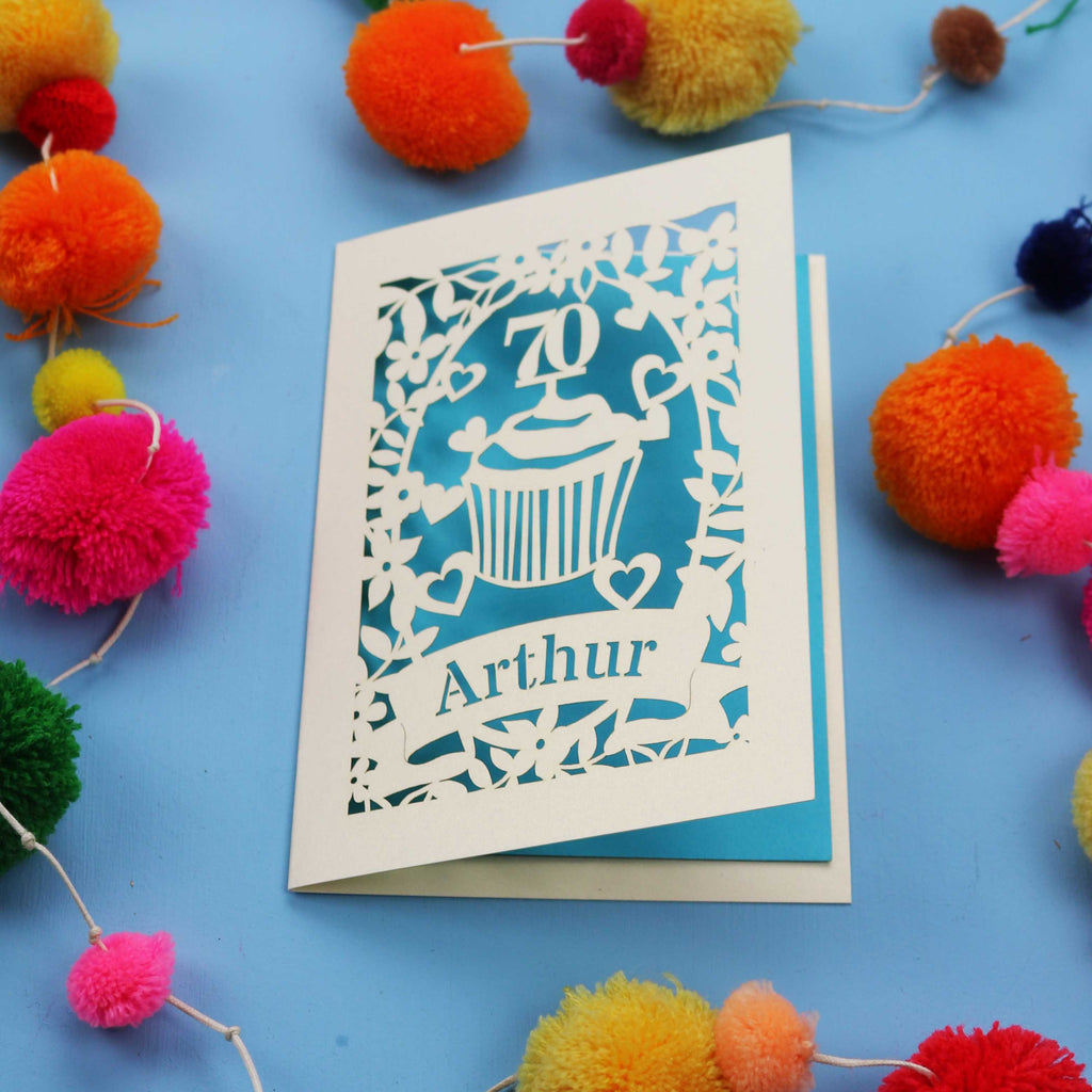 A laser cut 70th birthday card with cupcake design and personalised with a name
