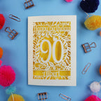 90th Birthday card with 'Happy Birthday 90 Albert' on a blue background with colourful pom-poms and paper clips.