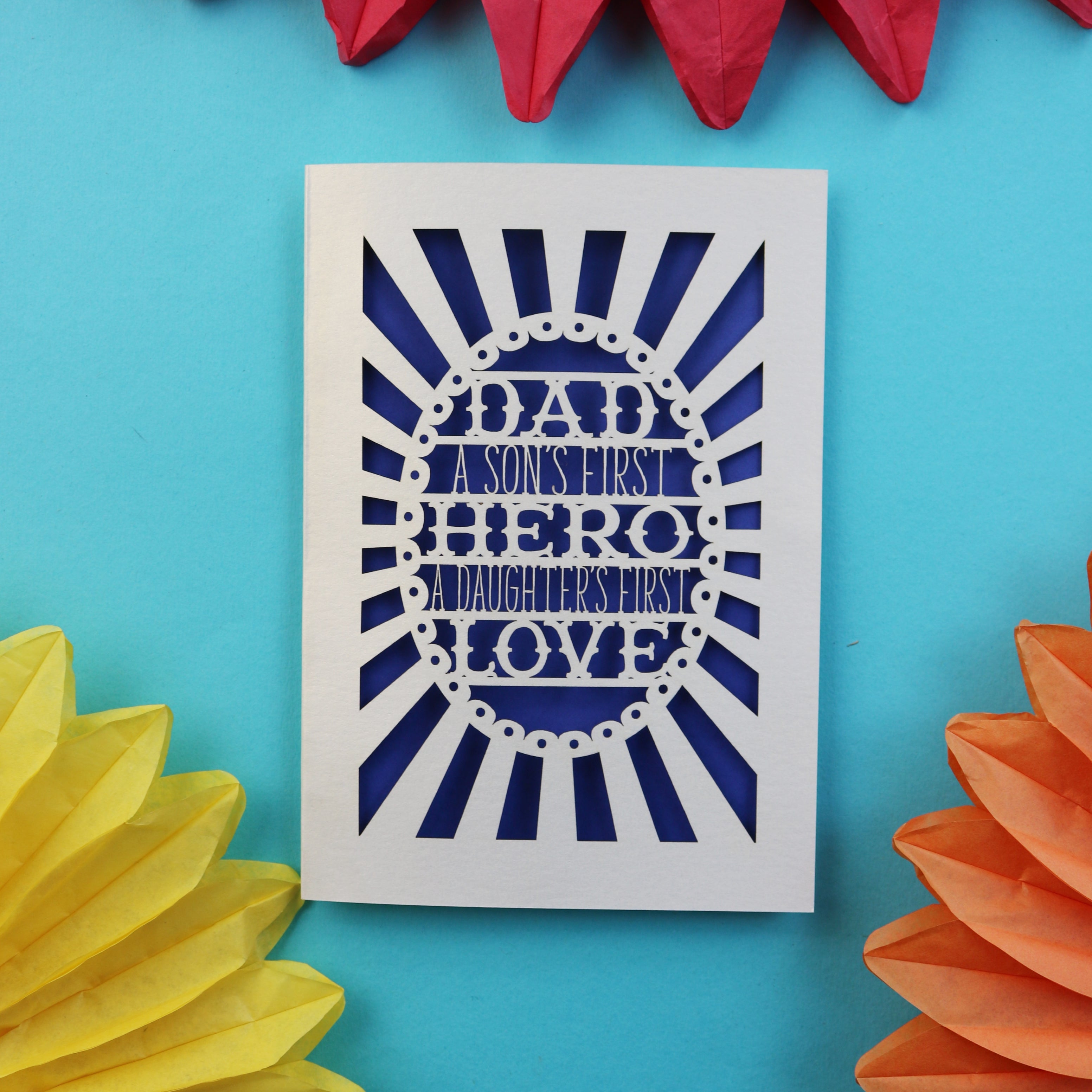 A father's day card that says "Dad, A son's first hero, a daughter's first love"