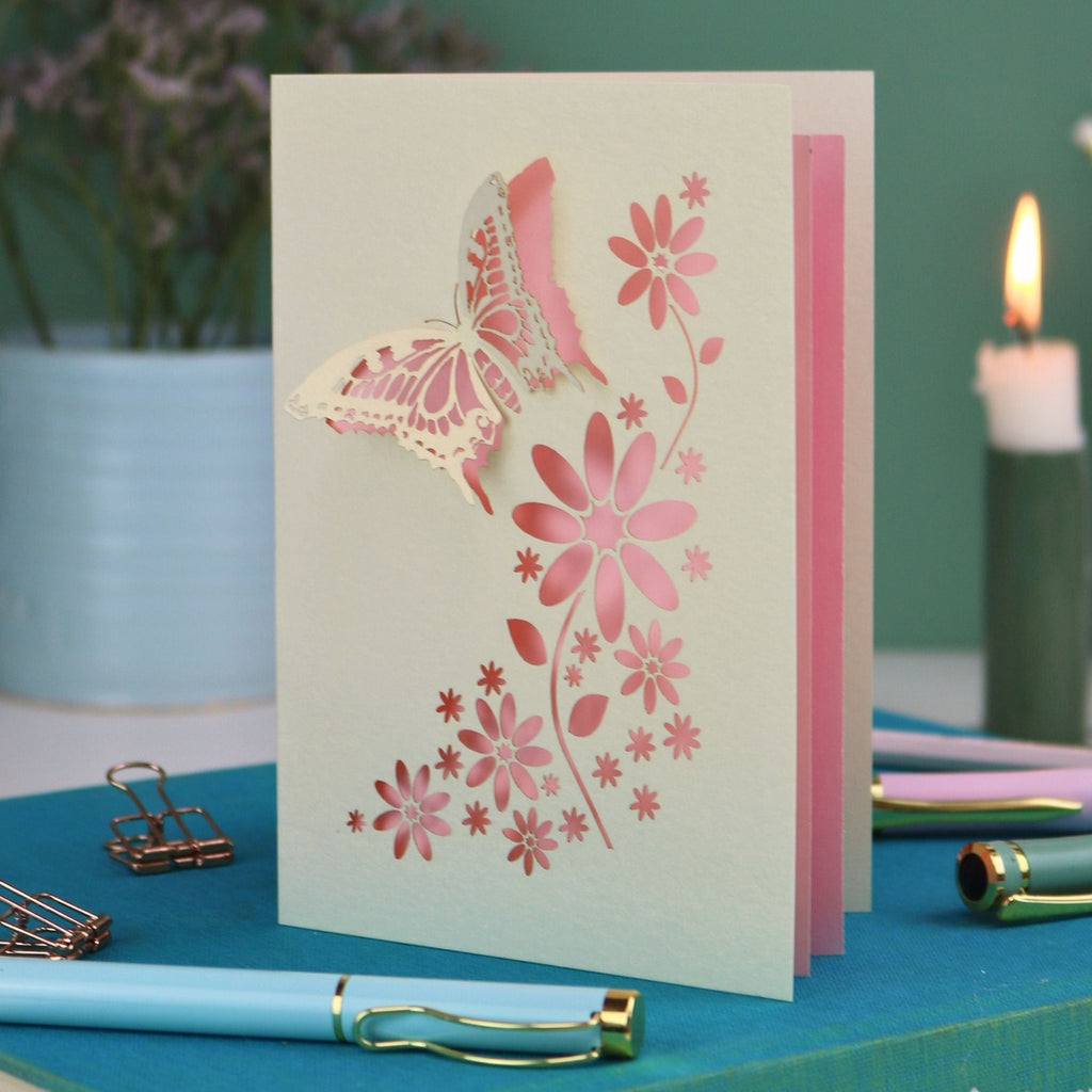 a laser cut 3D butterfly card with candy pink paper insert