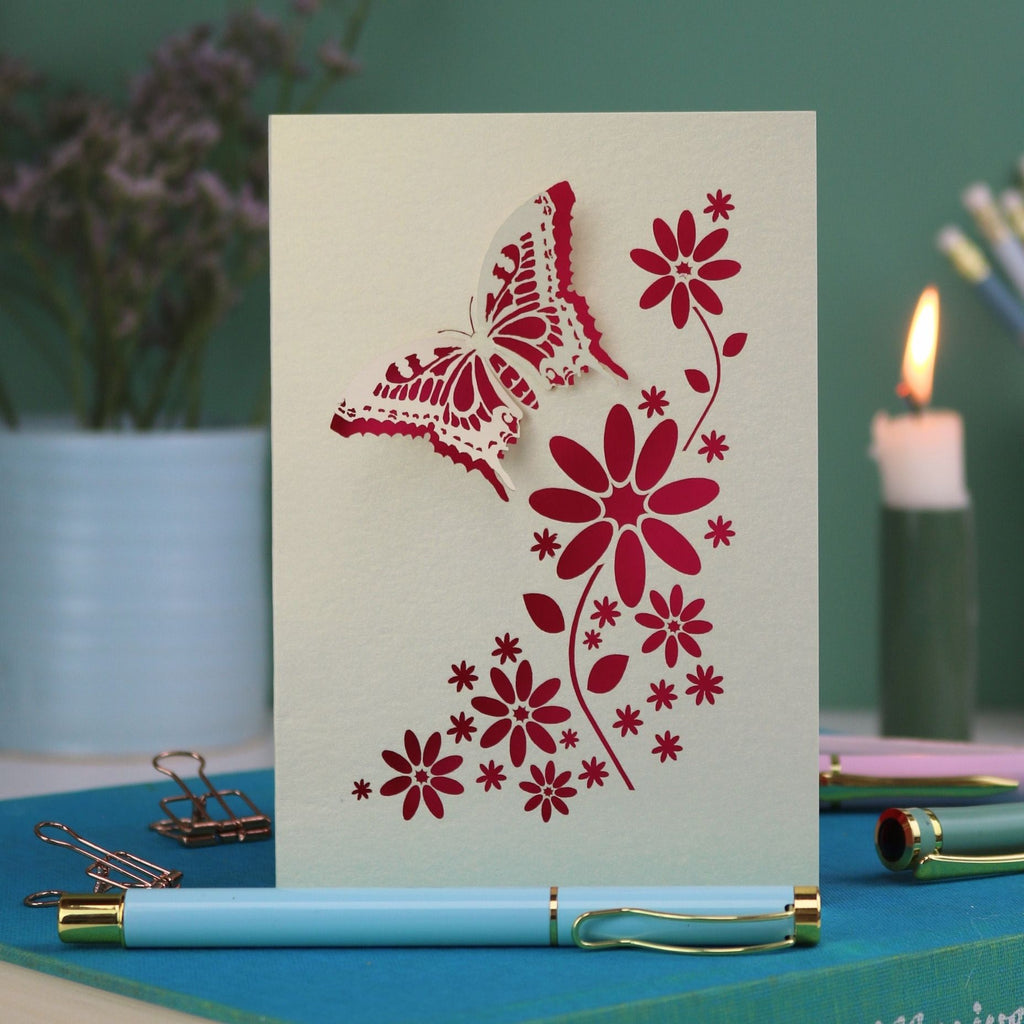 a laser cut 3D butterfly card with shocking pink paper insert