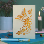 a laser cut 3D butterfly card with yellow paper insert