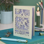 A laser cut carousel card with vintage fairground horse design and personalised with the name Olivia at the bottom