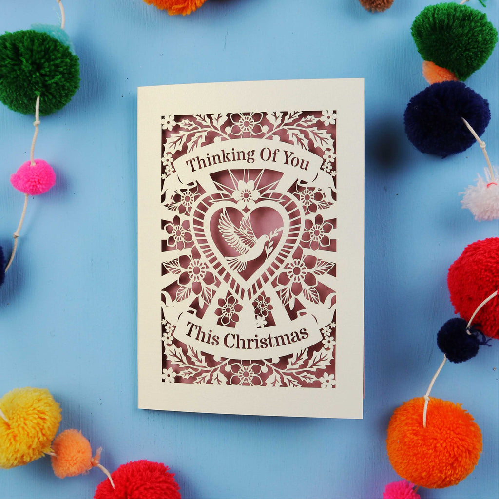 Laser cut Card with 'Thinking Of You This Christmas' text on a blue background 