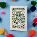 Laser cut Card with 'Thinking Of You This Christmas' text on a blue background 