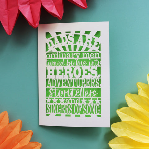 A unique father's day card laser cut with the words "dads are ordinary men turned by love into heroes, adventurers, storytellers and singers of song"
