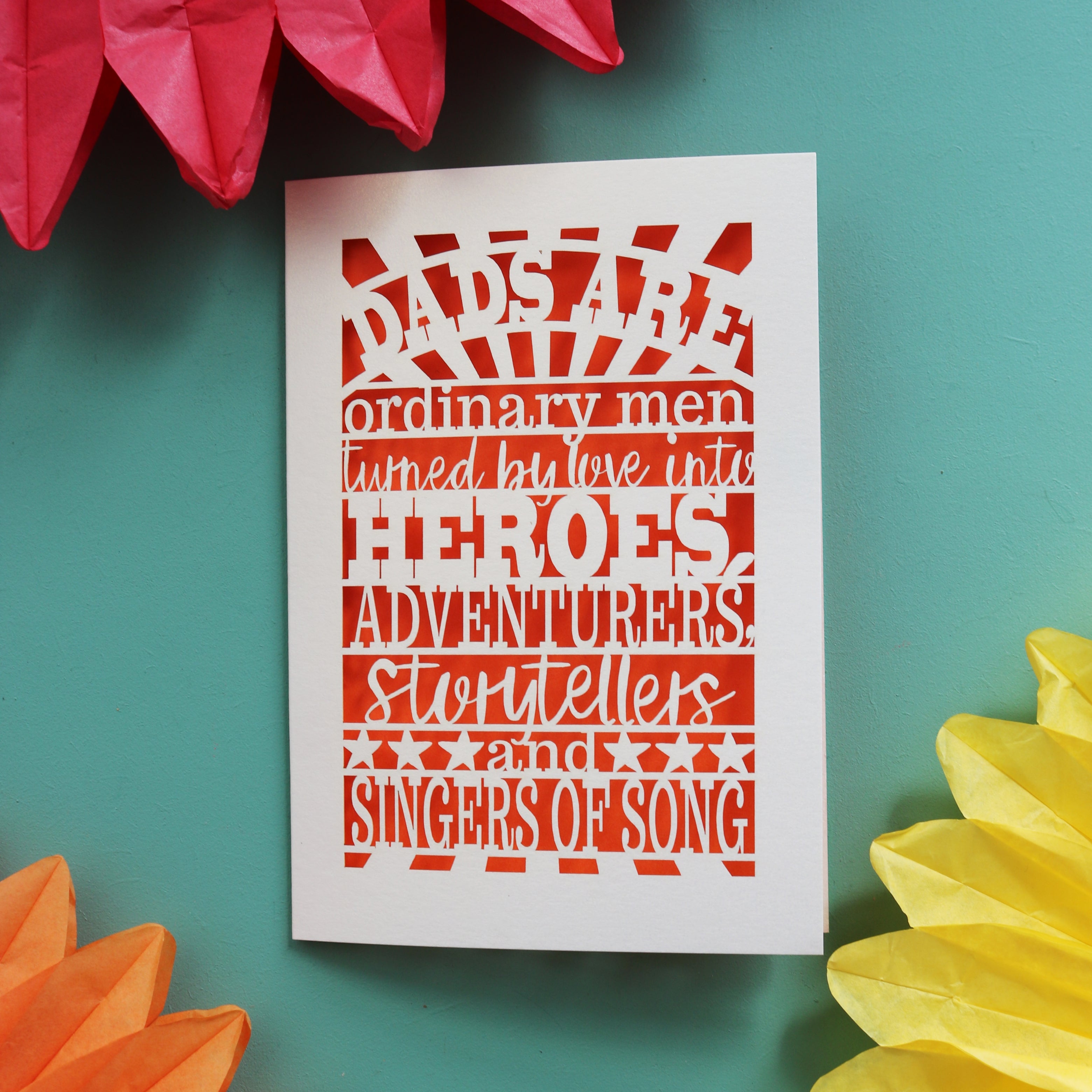 A happy father's day card laser cut with the words "dads are ordinary men turned by love into heroes, adventurers, storytellers and singers of song"