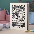 A laser cut Father's Day card with cream cut out card and a grey paper insert. Card has a globe design and the text "Happy Father's Day to the best dad in the world, love from" and is personalised with a name. 