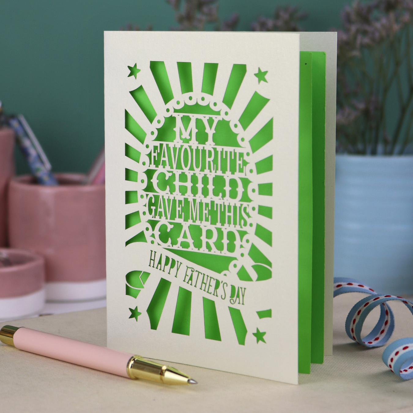 A laser cut funny Father's Day card with the cut out text, "My favourite child gave me this card. Happy Father's Day"