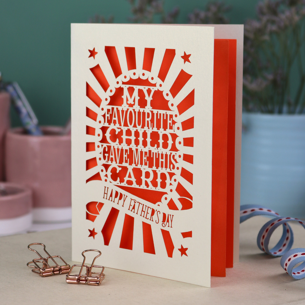 A laser cut funny Father's Day card with the cut out text, "My favourite child gave me this card. Happy Father's Day"