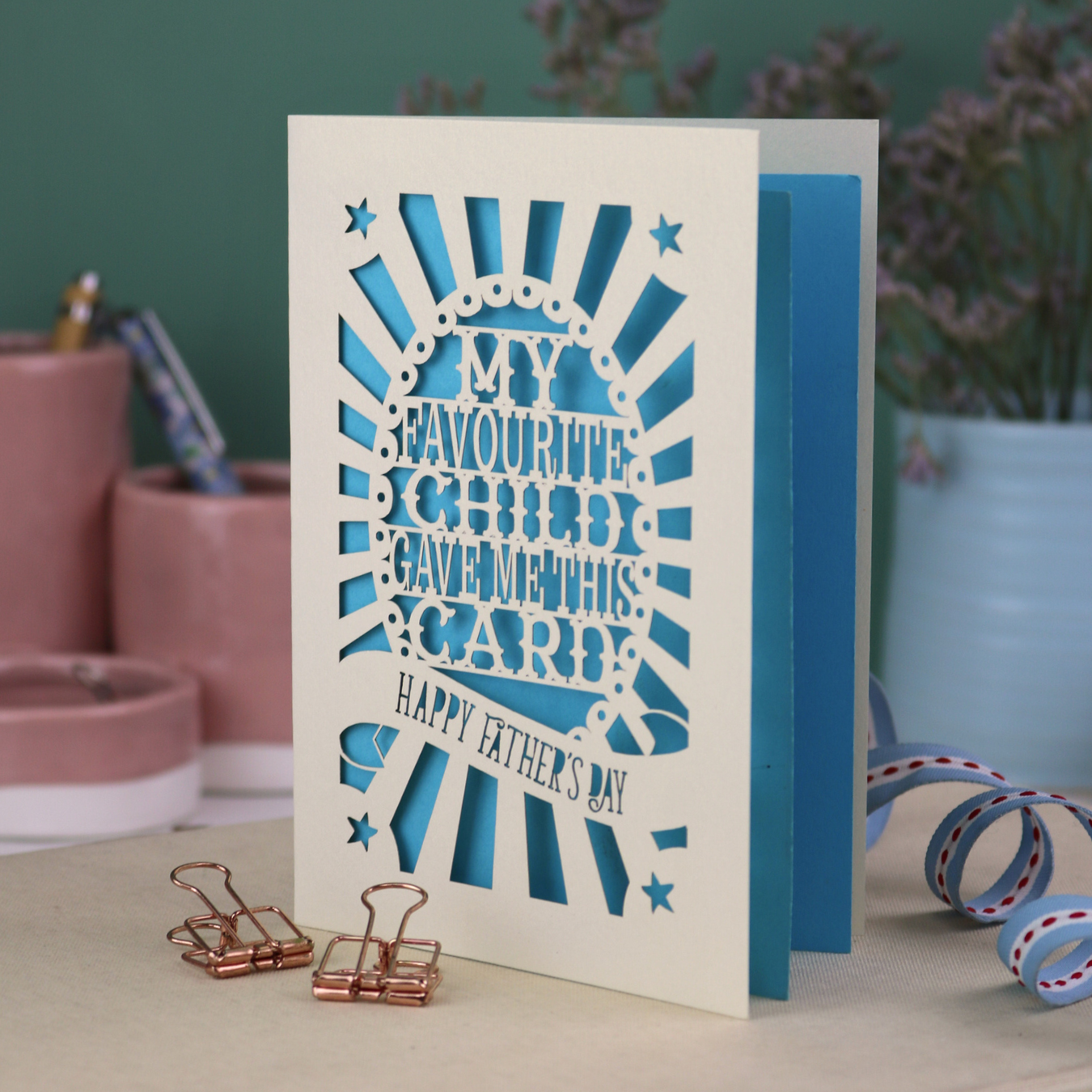 A laser cut funny Father's Day card with the cut out text, "My favourite child gave me this card. Happy Father's Day"