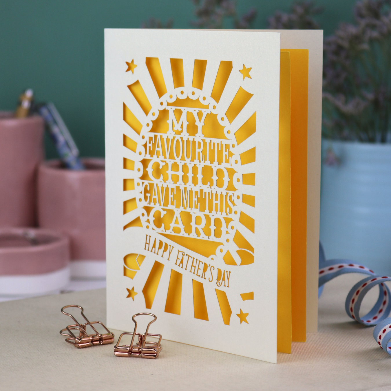 A laser cut funny Father's Day card with the cut out text, "My favourite child gave me this card. Happy Father's Day"