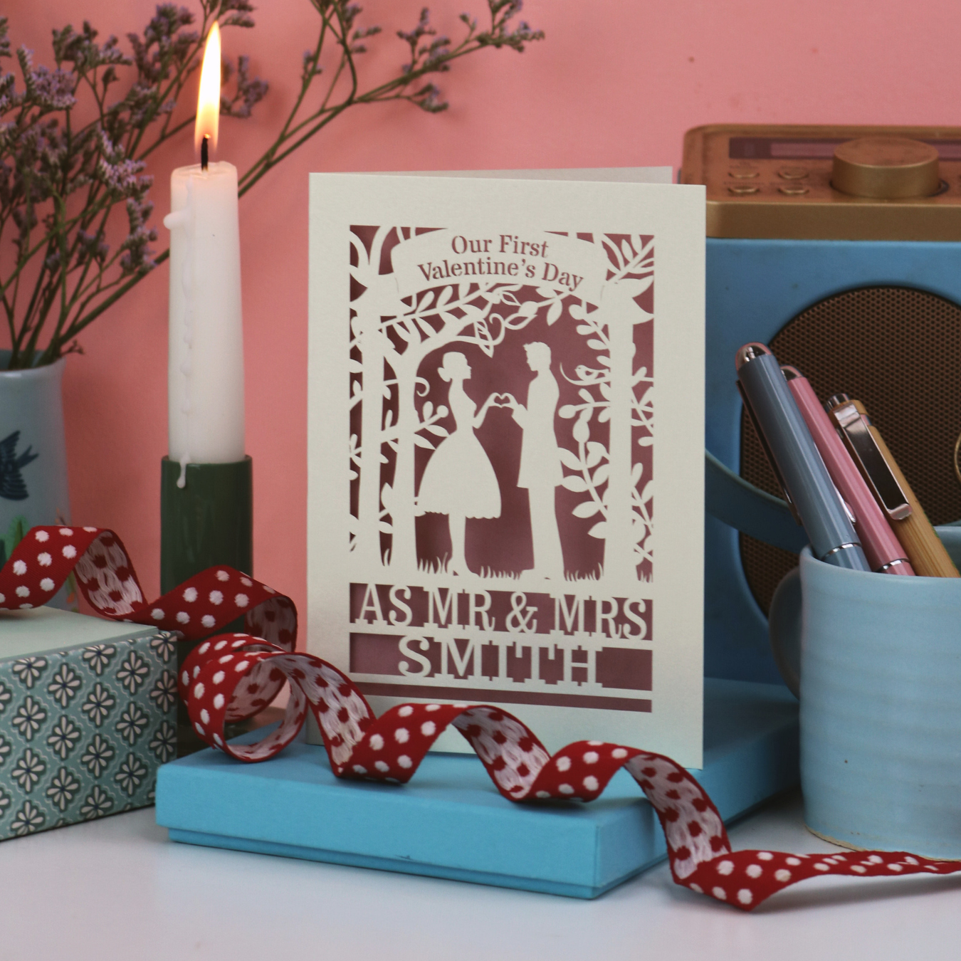 A laser cut first married Valentine's card with a couple making a heart with their hands and the words "Our first Valentine's Day as Mr  & Mrs Smith"