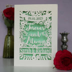 Laser cut wedding cards that say Forever and Always, and is personalised with a date and the names of the couple.