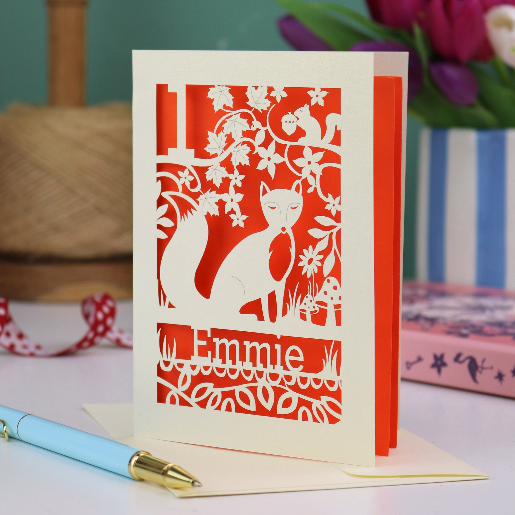 A laser cut first birthday card with fox design and personalised with "1" and "Emmie"