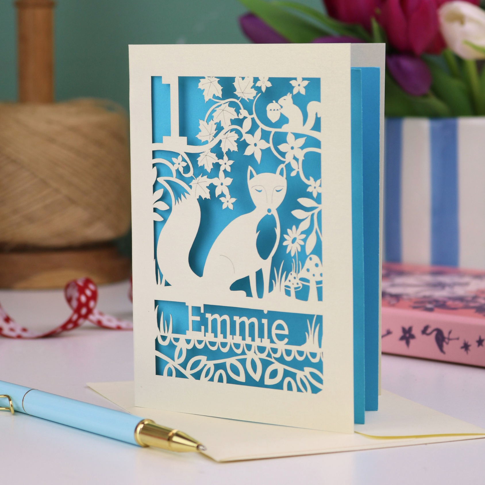 A laser cut first birthday card with fox design and personalised with "1" and "Emmie"