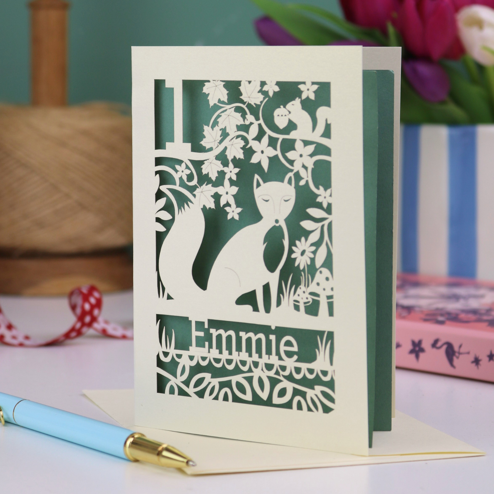 A laser cut first birthday card with fox design and personalised with "1" and "Emmie"