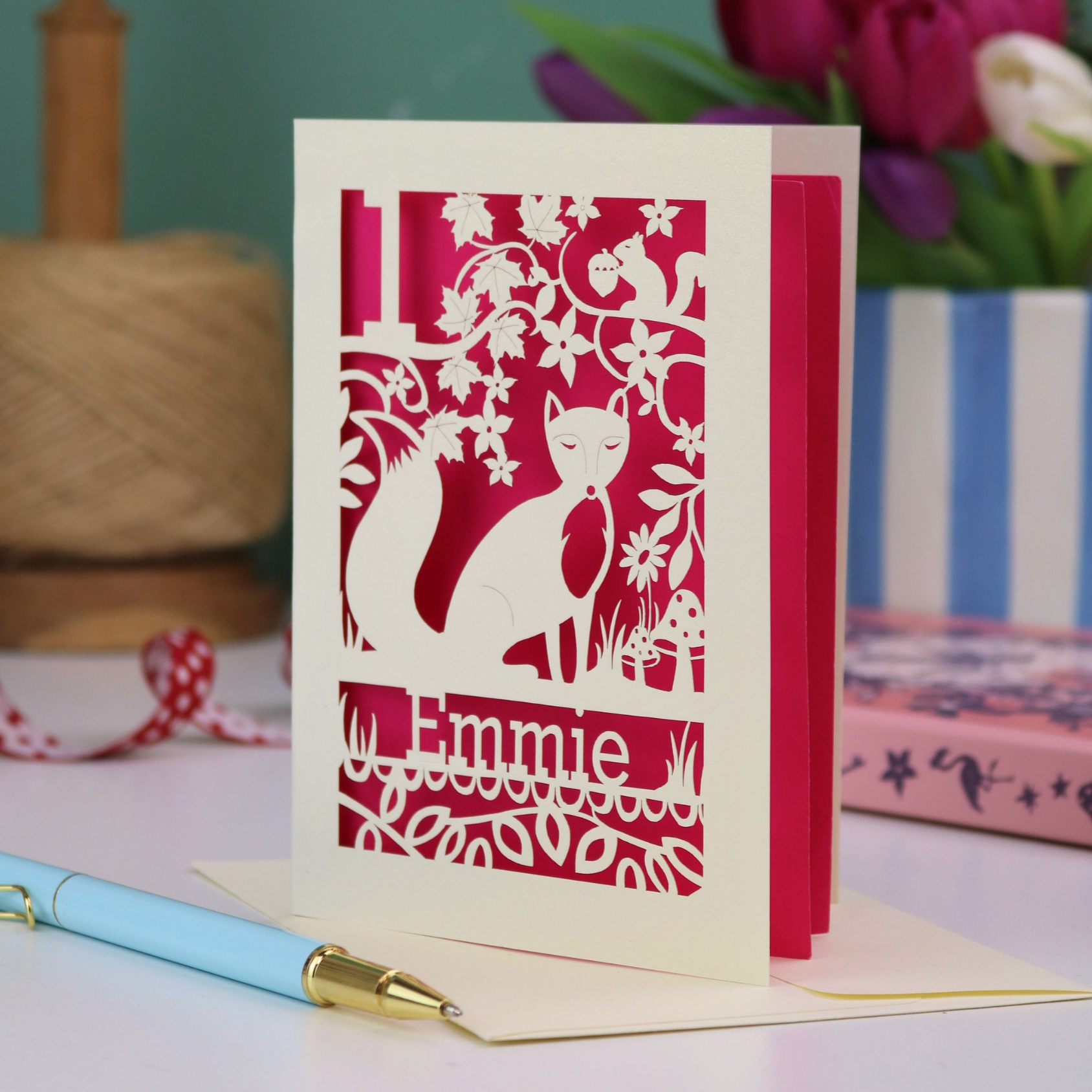 A laser cut first birthday card with fox design and personalised with "1" and "Emmie"