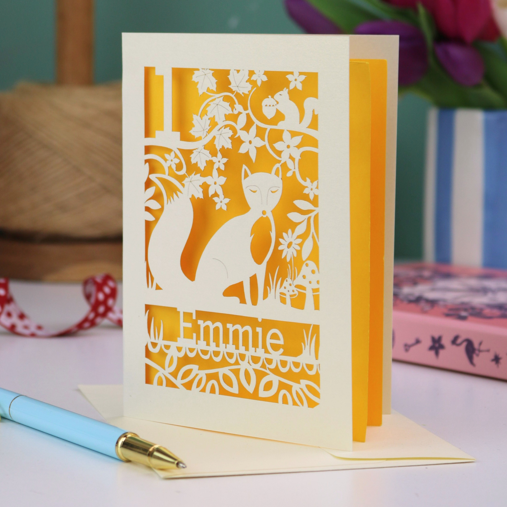 A laser cut first birthday card with fox design and personalised with "1" and "Emmie"