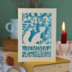 A laser cut fox birthday card with cut out fox illustration and woodland details, personalised with a name underneath the design. 
