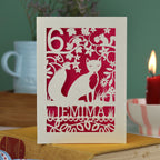 A laser cut birthday card with woodland scene and fox cut out design, personalised with an age in the top left, and a name at the bottom. 