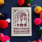 A personalised Our first Valentine's day card with a laser cut design of two women making a heart shape, with a blank space for a personal message, and brightly coloured pom-pom decorations around it.