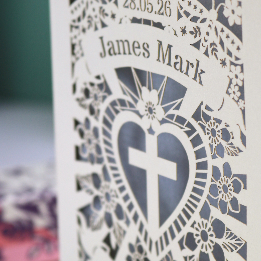 Personalised Godson Baptism card with decorative elements on a wooden surface.