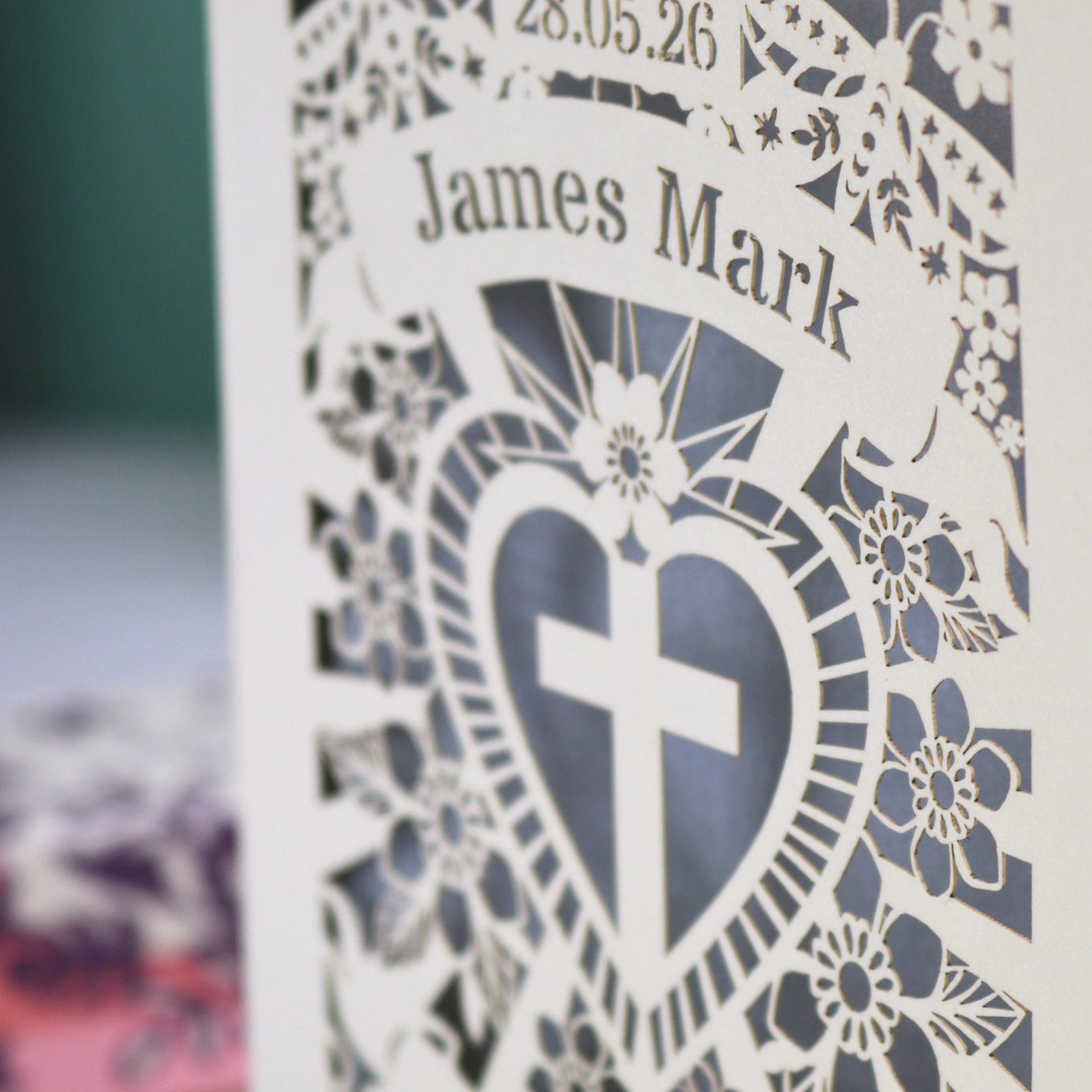 Personalised Godson Baptism card with decorative elements on a wooden surface.