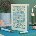 A personalised laser cut Mother's Day card with floral design and the text "Happy Mother's Day Love From Hayley"
