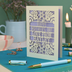 A personalised laser cut Mother's Day card with floral design and the text "Happy Mother's Day Love From Hayley"