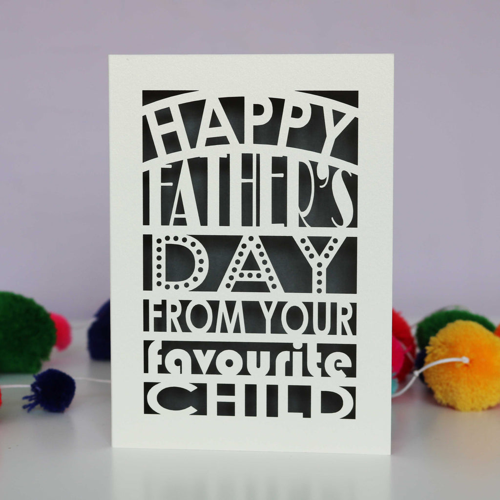 A laser cut fathers day card that says "Happy Father's Day from your favourite child"