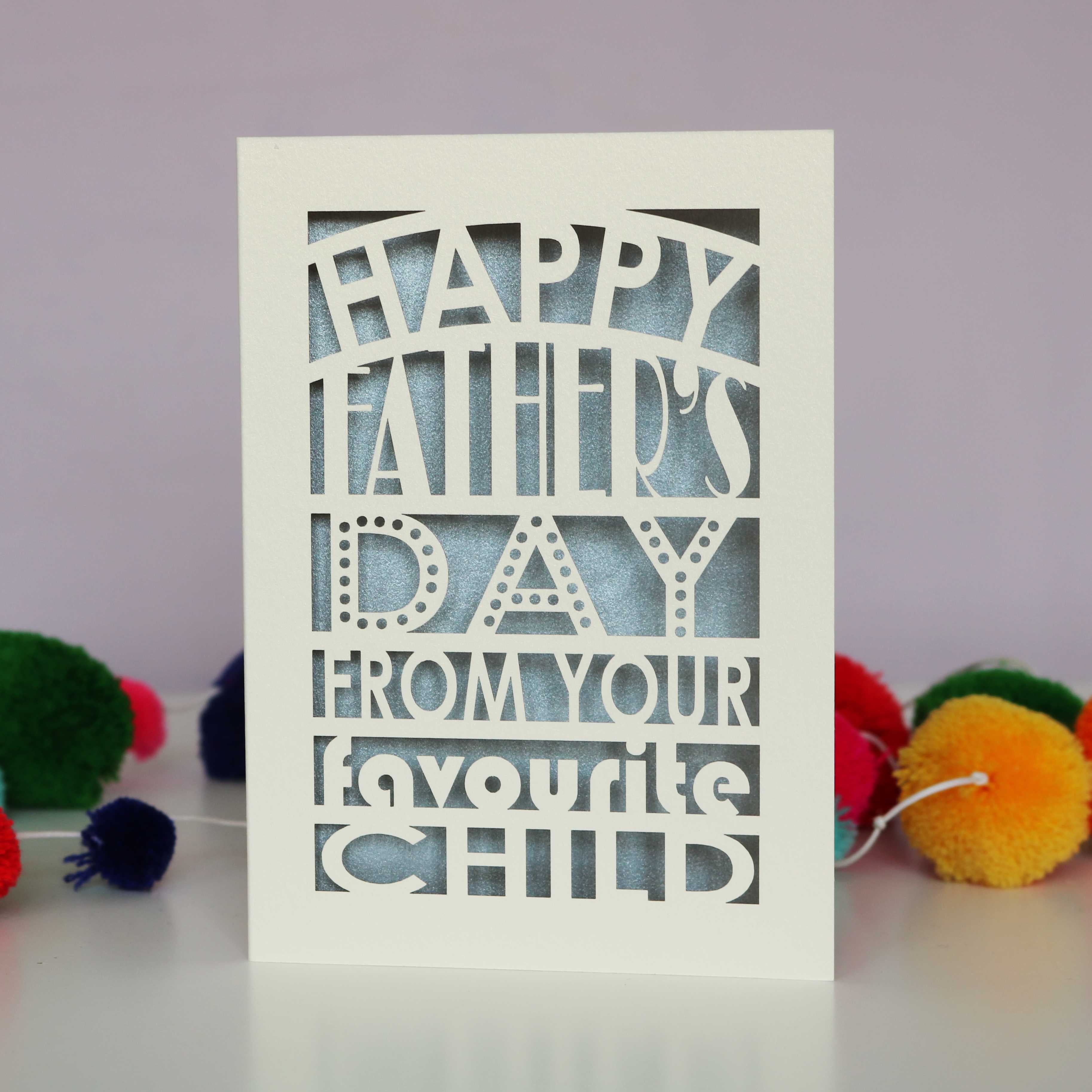 A cut out fathers day card that says "Happy Father's Day from your favourite child"