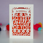 A laser cut graduation card that is personalised with a name and reads "So very proud of you"