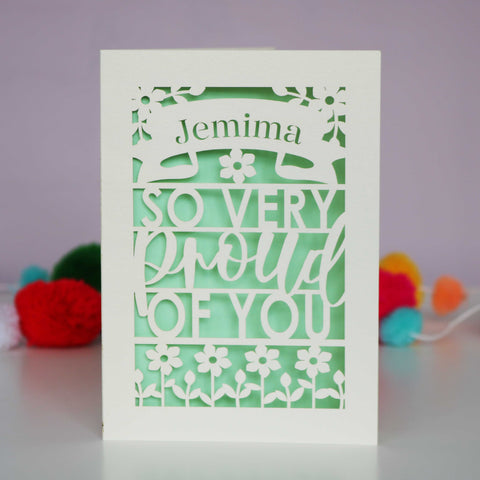 A laser cut card for graduation that is personalised with a name and reads "So very proud of you" - A6 (small) / Light Green