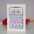 A laser cut card for daughter that is personalised with a name and reads "So very proud of you"