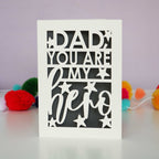 A cream and grey laser cut fathers day card that says "Dad you are my hero"