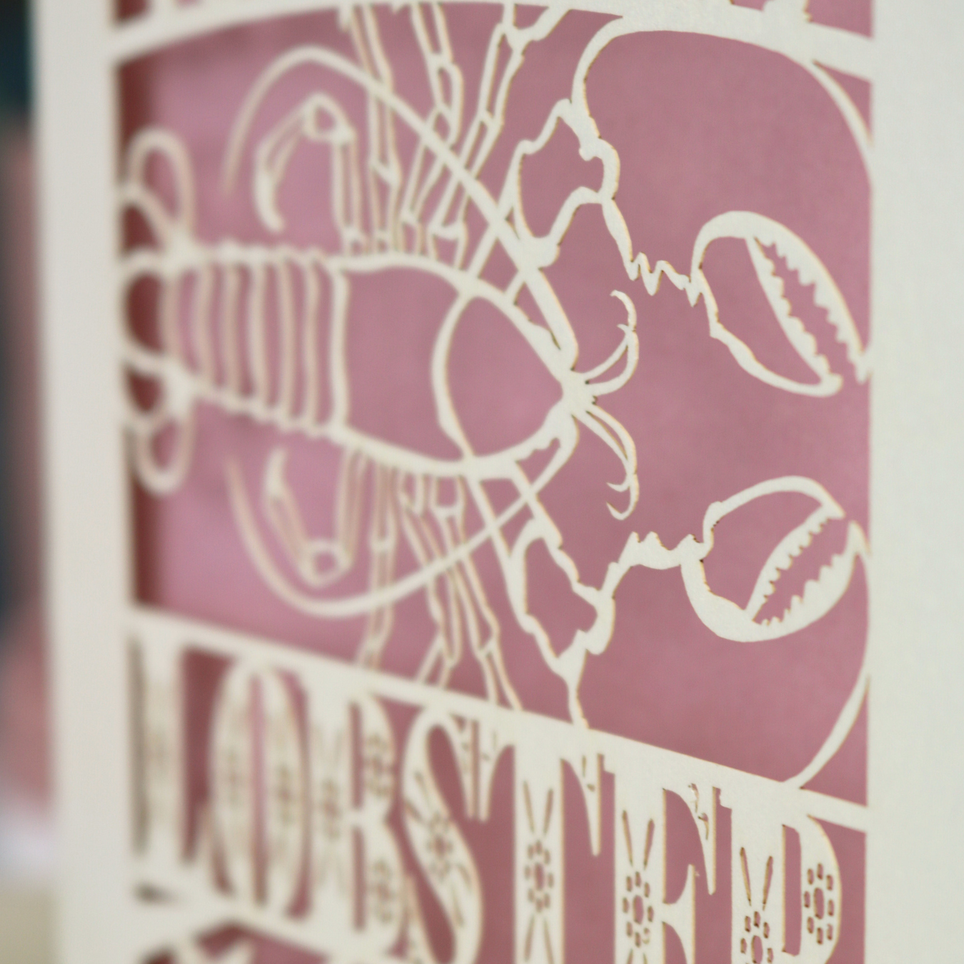 A laser cut Valentine's card with lobster design and text "You're My Lobster"